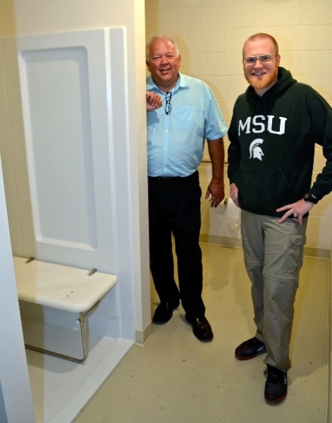 Metro Lutheran Ministry Board member Duane Dean, left, looked over a new shower at St. Luke's Lutheran Church with Pastor Scott Eberlein. (Photo from Dale Garrison)