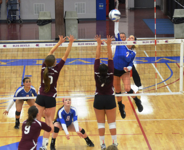 KCKCC sophomore Blair Russell (7) soared for a kill against Hesston Wednesday night while teammates Kimberly Martinez (2) and Lily Cullers ready for a possible block in the Lady Blue Devils 3-0 win. (KCKCC photo by Rodney Christensen)