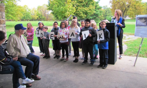 Students from Junction Elementary School spelled out "sidewalk" in today's sidewalk dedication. The ribbon-cutting ceremony was in Matney Park near 42nd and Shawnee Drive. (Staff photo by Mary Rupert)