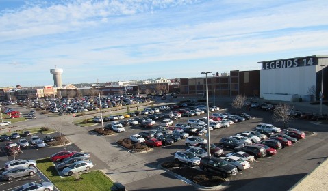 The parking lot at The Legends Outlets at I-435 and I-70 in Kansas City, Kan., was crowded on Christmas Eve 2015. This week, a deal closed to sell The Legends Outlets to a Chicago real estate investment firm.