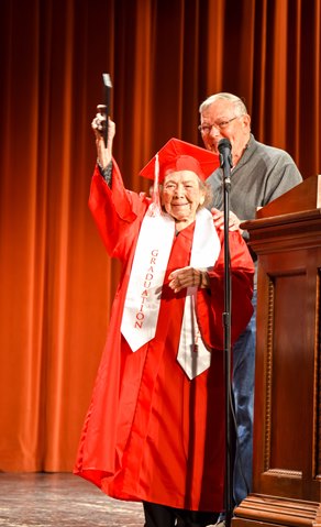 Irene Gier Hill, 103, received an honorary diploma from Wyandotte High School on Wednesday at a program at the school. Many years ago, Hill quit school to take care of her dying mother. A program was held at the school Wednesday for the launch of Craig Delich’s new book on Wyandotte High School history. For more information on the new book, visit https://www.facebook.com/profile.php?id=100008105178383&fref=ts. (Photo by Grace Elmore, Kansas City, Kan., Public Schools)