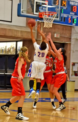  KCKCC’s Cheyenne North (20) goes up for two of her 19 points in the Blue Devils come-from-behind 79-74 win over North Central. North also had 15 rebounds and 8 assists for a near triple double. (KCKCC photo by Alan Hoskins) 