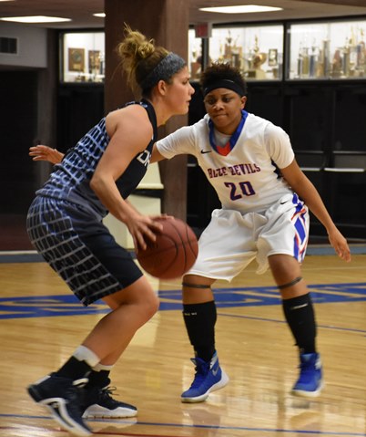 KCKCC forward Cheyenne North focused on stopping Livin’ The Dream’s Kelsey Balcom in the Lady Blue Devils’ 14th straight win 82-70 Monday. North led all rebounders with a career high 17 and scored 14 points; Balcom led all scorers with 22 points. (KCKCC photo by Alan Hoskins)