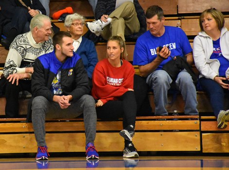 Former KCKCC standout and now a member of the Kansas basketball team, Clay Young, front, was joined by his grandparents, from left, Gene and Ada Young and parents Paul and Teresa Young and KCKCC women’s player Janay Jacobs in watching Trevor Young lead KCKCC in scoring with 15 points in a 75-68 win over Penn Valley Tuesday. (KCKCC photo by Alan Hoskins) 