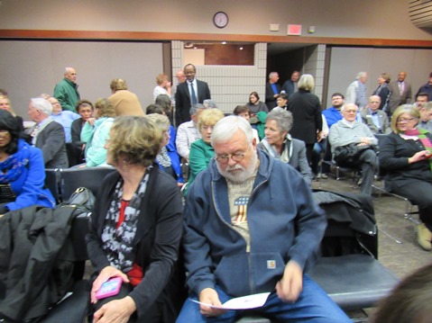 A large crowd chatted at the library before the start of the Wyandotte County legislative delegation forum on Jan. 5. (Staff photo by Mary Rupert)