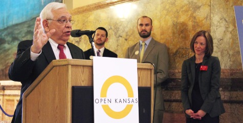 Rep. John Rubin, left, a Shawnee Republican, spoke at Wednesday's Open Kansas event. He and Rep. John Wilson, a Lawrence Democrat, second from left, are the first two legislators to sign a “transparency pledge” to taxpayers. They were joined at the podium by Benet Magnuson, executive director of Kansas Appleseed and Shannon Cotsoradis, president and chief executive of Kansas Action for Children.  (Photo by Susie Fagan-KHI News Service)