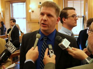 Budget Director Shawn Sullivan talks with reporters after presenting the governor’s budget plan Wednesday to legislators.  (Photo by Stephen Koranda/Kansas Public Radio)