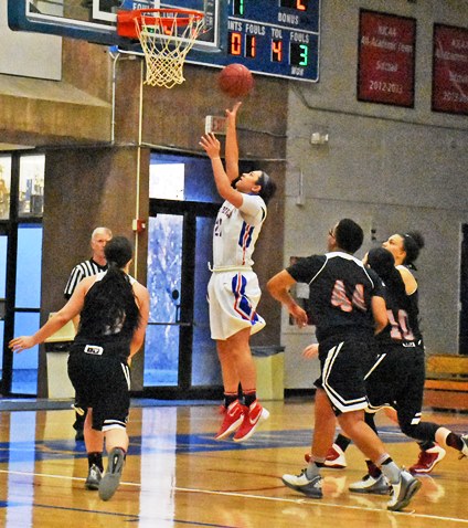 KCKCC forward Brie Tauai outmaneuvered four Labette defenders for a layup in a 24-2 Blue Devil start on the way to an 89-33 victory Wednesday that boosted KCKCC’s record to 24-3. (KCKCC photo by Alan Hoskins)