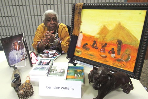 Berneice Williams, a retired registered nurse, started writing at age 60 and starting painting after age 76. She displayed her works Saturday at the Homegrown Reads program at the West Wyandotte Library. (Staff photo by Mary Rupert)