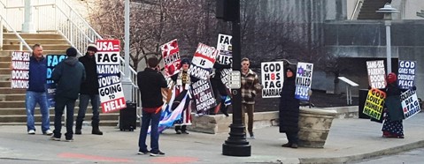 The Westboro Baptist Church of Topeka protested on a street corner near the Bernie Sanders rally on Wednesday, Feb. 24, in Kansas City, Mo. (Photo by William Crum)