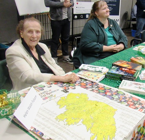 Helen Folsom, left, had a map of Ireland on display at her table at the Homegrown Reads program Saturday at the West Wyandotte Library. With her was Elizabeth Folsom, right, who designed Helen's book cover for "Kells: The Risin' of the Rebellion." (Photo by Mary Rupert)