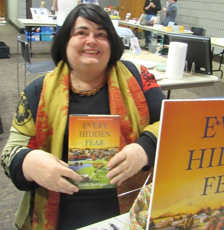 Successful mystery author Linda Rodriguez put down her knitting to discuss her book, "Every Hidden Fear," on Saturday at the Homegrown Reads program at the West Wyandotte Library. (Photo by Mary Rupert)