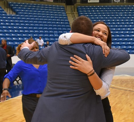 KCKCC assistant coaches Dawn Adams, left, and Chamissa Anderson were the first to congratulate head coach Joe McKinstry on his first Region VI championship. (KCKCC photo by Alan Hoskins)