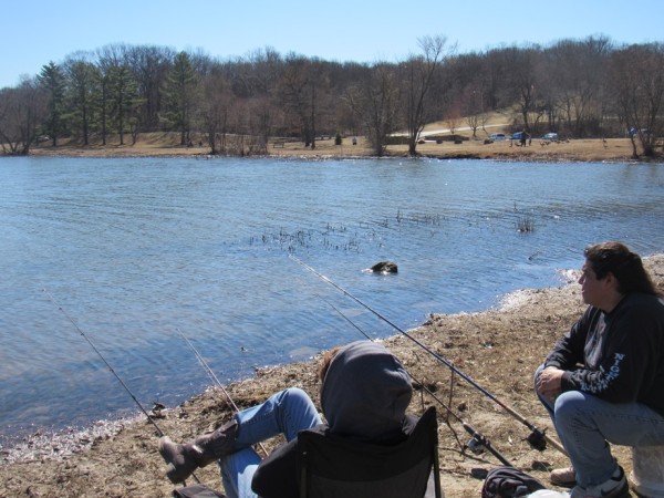 Pete Alejandre, right, and Sheri Stanley were waiting for a bite on the opening day of fishing Saturday at Wyandotte County Lake.  (Staff photo by Mary Rupert)