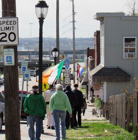 The small group walked down the sidewalk on  5th Street to observe St. Patrick's Day today in Kansas CIty, Kan. (Staff photo)