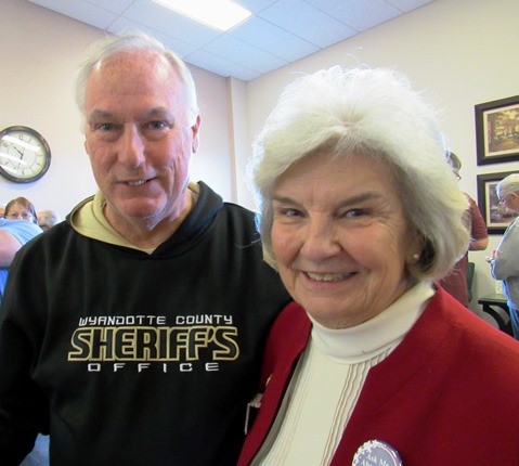 Sheriff Don Ash, left, talked with Zelma Sully, the treasurer of the Wyandotte County Republican Women, while waiting in line to vote at the Republican caucus Saturday, March 5, in Kansas City, Kan. (Staff photo)