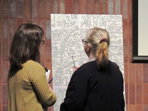 Residents viewed maps at a neighborhood stormwater meeting on Wednesday evening at the West Wyandotte Library, 1737 N. 82nd St., Kansas City, Kan. The residents filled out forms about stormwater problems in their area, which was between 81st and 85th streets, from Parallel Parkway to Georgia Avenue. John Menkhus, with the Unified Government’s engineering department, said there were some potential storm sewer issues in the area, and a study will look at the issues and estimate costs. Doug Carpenter with GBA Architects and Engineers said a preliminary engineering study is planned. Menkhus said a couple of these projects are being done each year. Another neighborhood meeting took place around 29th and Ohio. At the end of March, a study is expected to start in the Stony Point neighborhood. The meeting was coordinated by the Unified Government Public Works Department. (Staff photo)