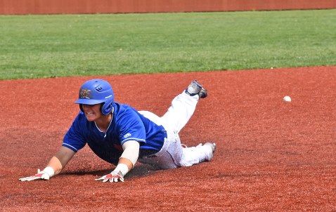 A sliding Conor Behrens clearly beats the throw on a run-scoring triple in Kansas City Kansas Community College’s 9-5 win over Allen County. Behrens also homered in the second game, his eighth of the season, but it wasn’t enough to prevent a 6-3 Blue Devil loss.(KCKCC photo by Alan Hoskins)