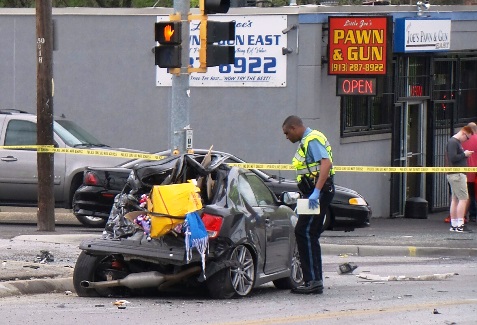 This was a crash scene near 51st and Leavenworth Road after bank robbery suspects were chased through Kansas City, Kan. (Photo by Lou Braswell)