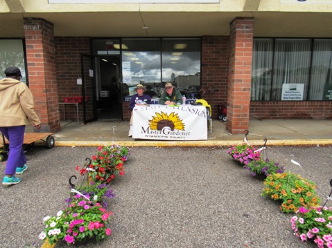 David Young, left, and Don Crim staffed a table for the Master Gardeners Plant Sale Saturday, April 30, at the Extension Office, 1200 N. 79th St., (west of Kmart), Kansas City, Kan. The sale runs through 2 p.m. Saturday. They had tomato and pepper plants, herbs, hanging baskets, flowers and more available. Proceeds benefit the Master Gardeners’ activities in Wyandotte County. (Staff photo by Mary Rupert)