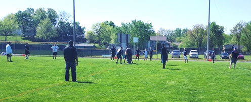 “Be Active Day” today at Bishop Ward High School included a flag football game, the Battle of the Badges, between police and firefighters at Dorney Field in Kansas City, Kan. Also included in “Be Active Day” was the annual Tour de Cyclone bike ride and a Bishop Ward baseball game. (Photo by William Crum) 