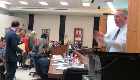 Rob Richardson, right, UG planning director, counted people who were standing at the Planning Commission meeting on Monday night. (Staff photo by Mary Rupert)