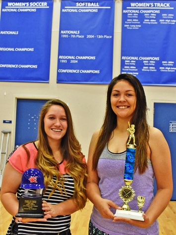 A Leavenworth grad, Mekayla Foskett, left, is the recipient of the Justin Cothran “Life’s Tough, Get a Helmet” award while Raytown grad Brittany Gustin was voted the Most Valuable Player on the 2016 softball team at Kansas City Kansas Community College. (KCKCC photo by Alan Hoskins)