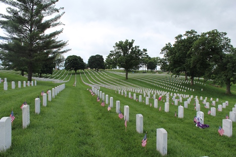 Boy Scouts, Cub Scouts and other youth from Kansas City, Kan., and other areas helped place flags on veterans’ gravemarkers on Saturday morning at the Leavenworth National Cemetery, near K-7 and K-5 in Leavenworth, Kan.  Monday is Memorial Day, which is set aside to honor those who died in service to their country. The U.S. Census Bureau estimated that more than 1 million U.S. men and women have died in military service since the Civil War. (Photo by Steve Rupert)