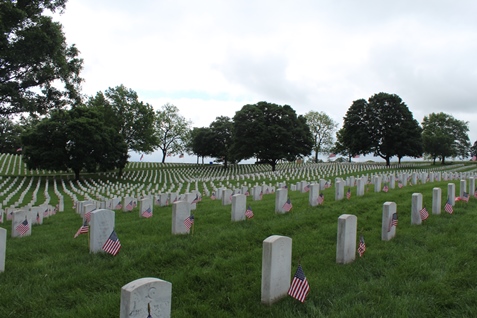 Boy Scouts, Cub Scouts and other youth from Kansas City, Kan., and other areas helped place flags on veterans’ gravemarkers on Saturday morning at the Leavenworth National Cemetery, near K-7 and K-5 in Leavenworth, Kan.  Monday is Memorial Day, which is set aside to honor those who died in service to their country. The U.S. Census Bureau estimated that more than 1 million U.S. men and women have died in military service since the Civil War. (Photo by Steve Rupert)