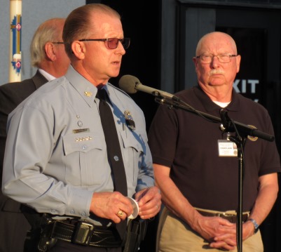 Police Chief Terry Zeigler, left, urged family and friends of Detective Lancaster to lean on each other and support each other in the coming days. To the right was the Rev. Mike May. (Staff photo)