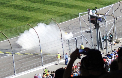 Kyle Busch does a burnout in front of the  grandstand after winning the Go Bowling 400 Saturday night at the Kansas Speedway in Kansas City, Kan. (Fan photo)