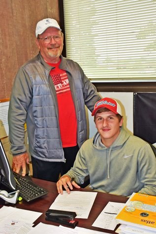 KCKCC sophomore Dalton Ayres had head coach Gary Shrader as a witness as he signed a golf letter of intent to play at Fort Hays State University next fall. (KCKCC photo by Alan Hoskins)