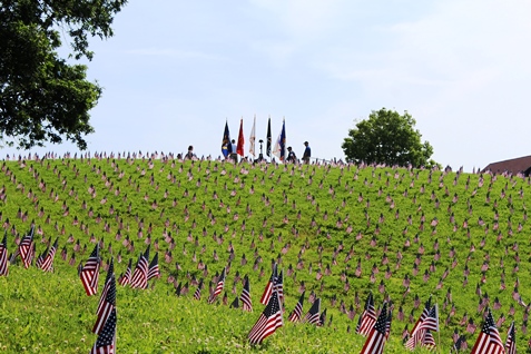 A memorial ceremony was held on Monday at Kansas City, Kan., City Park, 26th and Park Drive, to honor fallen veterans. The American Fallen Warrior Memorial Foundation held the ceremony and placed about 8,000 flags on the hills of City Park, where they are visible from I-70. Donations from Home Depot helped with the flags. The foundation is planning to build a monument at City Park to honor veterans who died in the Gulf War and the war on terror. For more information, visit http://afwmf.org/. (Photo by Steve Rupert)