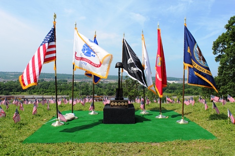 A display at a memorial ceremony Monday at Kansas City, Kan., City Park, 26th and Park Drive, to honor fallen veterans. The American Fallen Warrior Memorial Foundation held a ceremony and placed about 8,000 flags on the hills of City Park, where they are visible from I-70. Donations from Home Depot helped with the flags. The foundation is planning to build a monument at City Park to honor veterans who died in the Gulf War and the war on terror. For more information, visit http://afwmf.org/. (Photo by Steve Rupert)