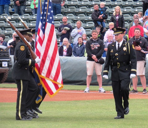 A police honor guard presented the colors, in conjunction with a tribute to Detective Brad Lancaster, at the T-Bones home opener Thursday night at CommunityAmerica Ballpark, Kansas City, Kan. 