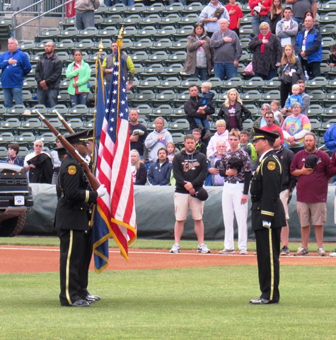 A police honor guard presented the colors, in conjunction with a tribute to Detective Brad Lancaster, at the T-Bones home opener Thursday night at CommunityAmerica Ballpark, Kansas City, Kan. 