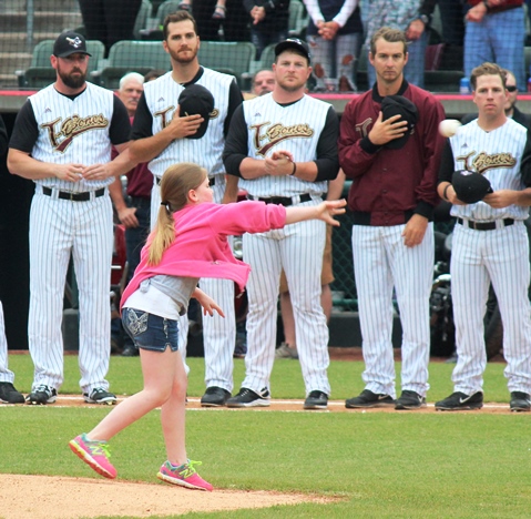 Detective Brad Lancaster's children threw out the first pitch at Thursday's T-Bones home opener at CommunityAmerica Ballpark, Kansas City, Kan. 