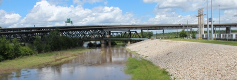 Looking north on the Kaw River from the James Street Bridge on Saturday. The Kansas River  was in minor flood stage on Saturday.