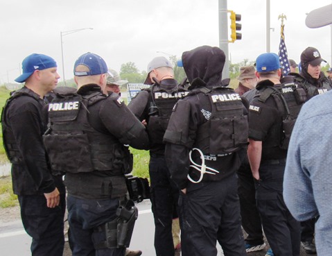 Members of the Kansas City, Kan., Police Department gathered near 118th and Speedway Drive today before a memorial run started this morning. The run was in honor of slain Detective Brad Lancaster. (Staff photo)