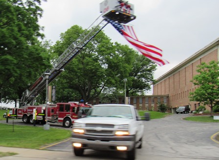 A flag flew at a visitation on Friday evening for Detective Brad Lancaster at Trinity Community Church, Kansas City, Kan. (Photo by a community member)