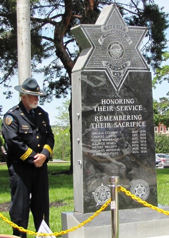 Rick Whitby, chief deputy, today stood next to the new monument honoring fallen Wyandotte County Sheriff's officers. (Staff photo)