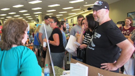 Author Kerri Fivecoat-Campbell, left, signed copies of her book, "Living Large in Our Little House," and visited with readers from 2 to 4 p.m. today at Books-A-Million book store at The Legends Outlets, Kansas City, Kan. The author, who is from the Turner area of Kansas City, Kan., said her book went to the top of the small house and cabins category yesterday on Amazon. (Staff photo)