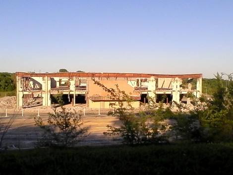 Demolition at Indian Springs Shopping Center at 47th and State Avenue in Kansas City, Kan., was nearing completion this week. The mall was built in 1971 and the demolition started in February of this year.  The Unified Government is the owner, and Lane4 Property Group is marketing the 100-acre redevelopment site on I-635 north of I-70.  (Photo by Bettse Folsom) 