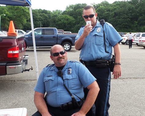 KCK police officers Toms and Sullivan were on duty at the Kids’ Fishing Derby.  (Photo from Leavenworth Road Association)