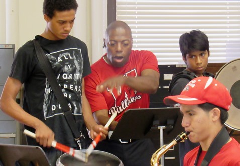 Band director Osmond Fisher, center, worked with Wyandotte High School percussionists during a recent rehearsal at the school. (Staff photo by Mary Rupert)