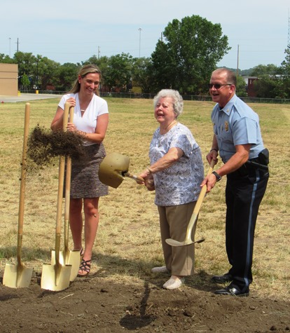 Dolores Johnson, center, a resident of the Argentine area, took her turn in the groundbreaking today for the new South Patrol police station at 21st and Metropolitan Avenue. With her was Police Chief Terry Zeigler, right, and Katherine Gallagher, left, associate architect with Hoefer Wysocki Architecture. (Staff photo)