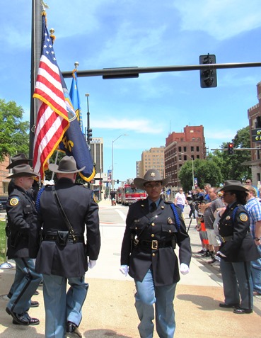 An honor guard presented the flag at a ceremony today at the Wyandotte County Courthouse lawn. (Staff photo)