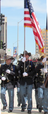 An honor guard presented the flag at a ceremony today at the Wyandotte County Courthouse lawn. (Staff photo)