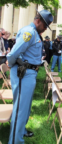 Shawnee County Sheriff Herman Jones paused for a moment of reflection during the dedication ceremony today at the Wyandotte County Courthouse lawn. (Staff photo)