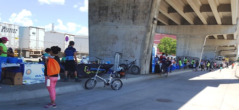 About 200 people attended the Armourdale Levee Fest from 11 a.m. to 2 p.m. Saturday, June 4, at 1900 Kansas Ave., Kansas City, Kan. Food and family activities were part of this event, which was held in conjunction with National Trails Day. The Armourdale Levee Trail starts west of 18th Street, below the Kansas Avenue bridge, near the Proctor and Gamble plant. At today’s event, Mayor Mark Holland said, “This is really amazing what they’re doing out here.”  (Photo by William Crum)